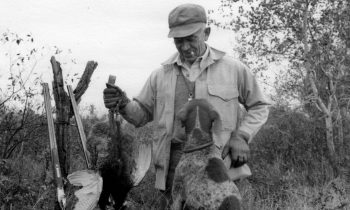 Leopold with a bird and his dog